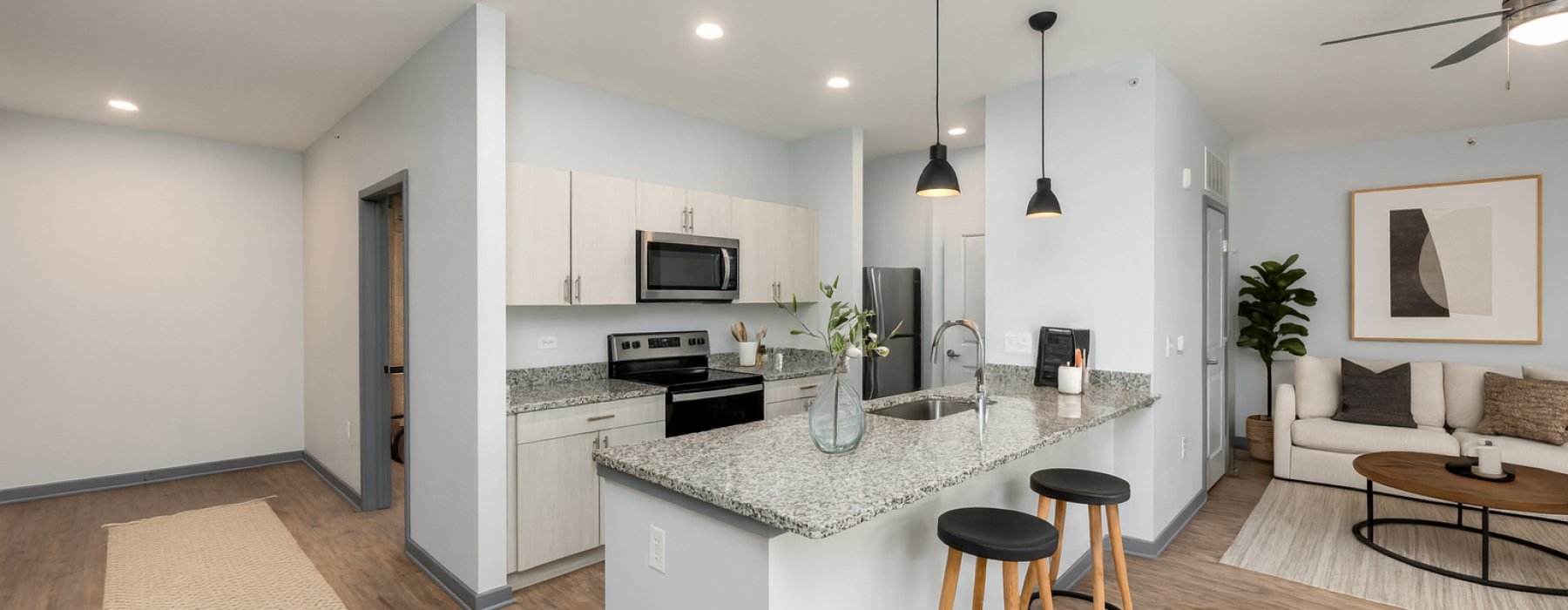 Staged apartment living room and kitchen