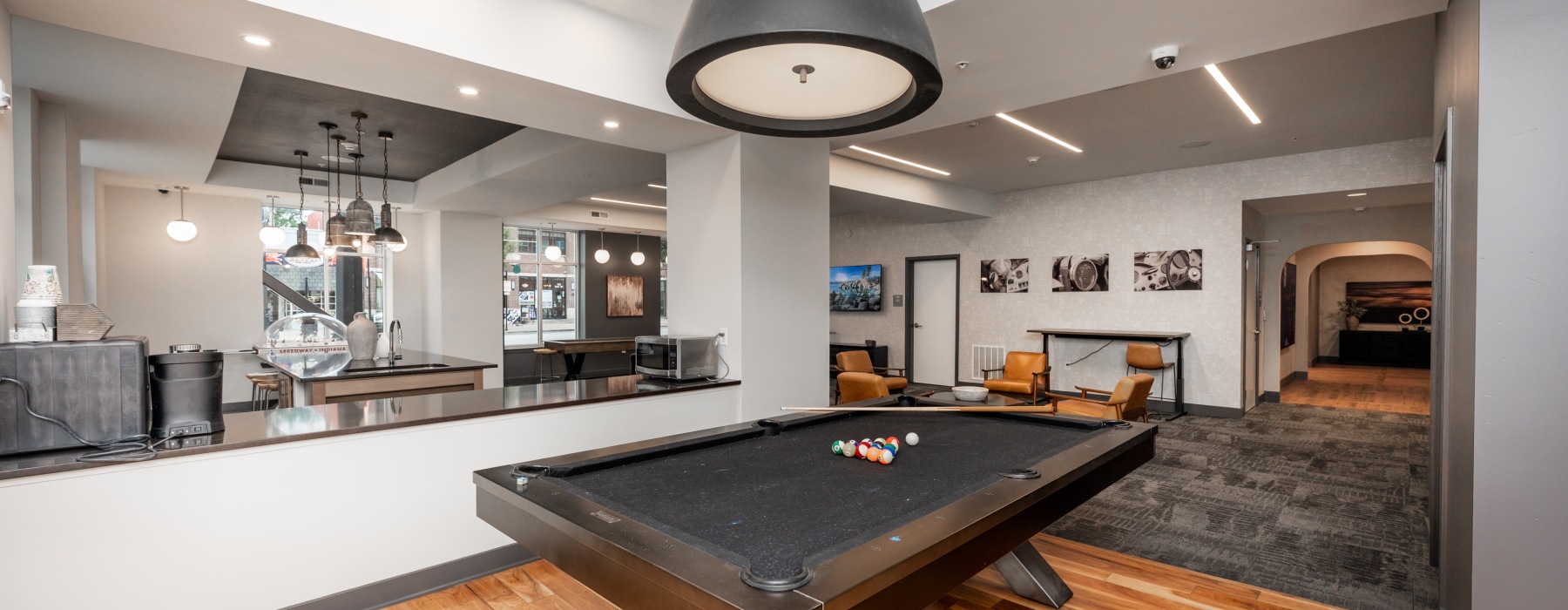 Billiards table with large pendant light